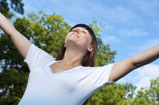 Pregnant Young Woman smile in summer park