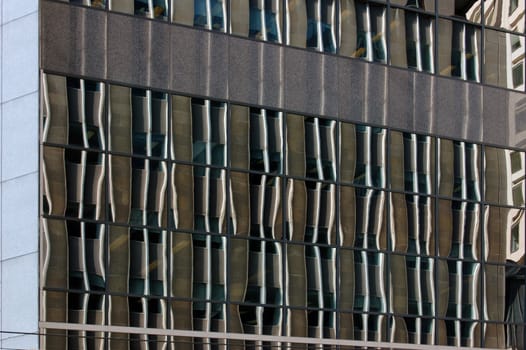reflection in a glass wall of a high-rise building