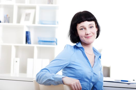 Portrait of a business woman in the office doing some paperwork