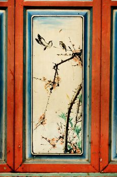 Antique Chinese art painting on wood wall of chinese temple