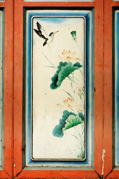 Antique Chinese art painting on wood wall of chinese temple