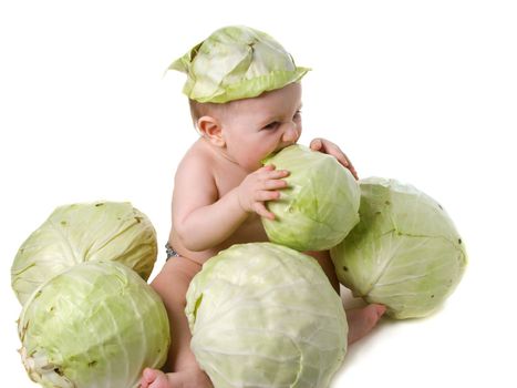 Tot plays with cabbage,acquaintance with useful vegetable