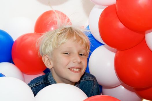 Smiling Boy with Balloons on White Background