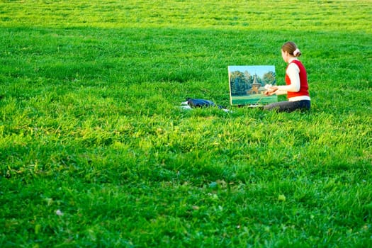 Painter on a Green Grass