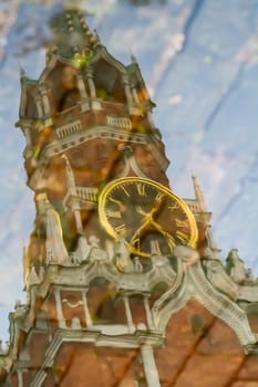 The Red Square. Reflection of the Kremlin. Chiming clock. Moscow, Russia.
