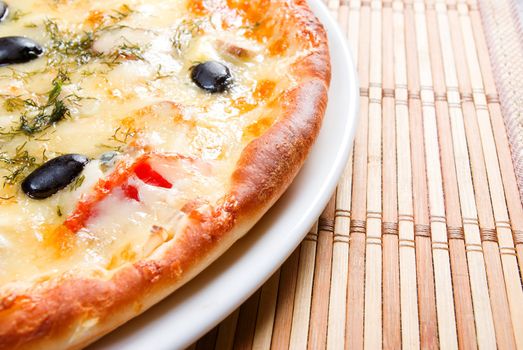 Supreme Pizza on plate.