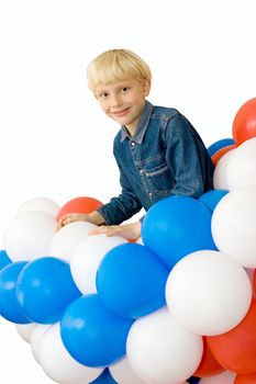 a smiling boy with balloons on white background