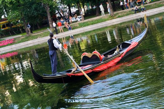 A gondolier works on a warm summer day