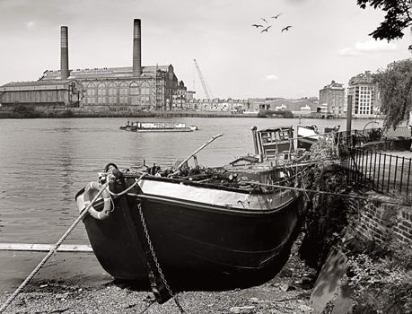 River with house bout and buildings