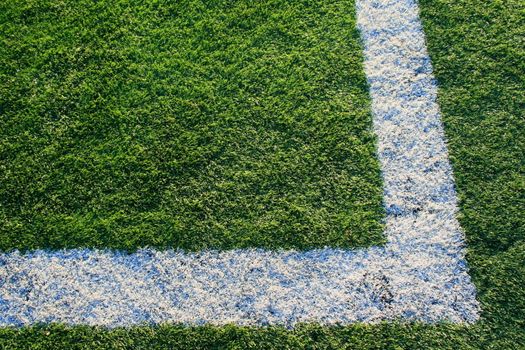 Close up of an artificial turf on a sports field.
