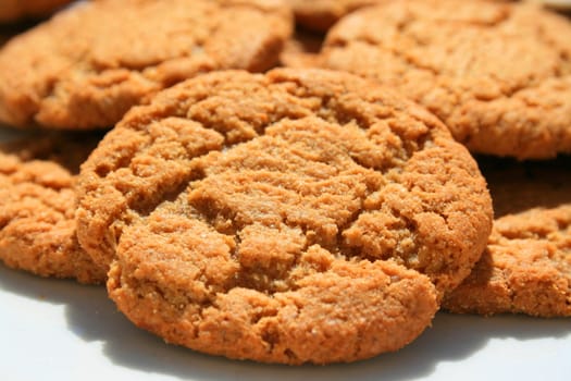 Close up of ginger snap cookies on a plate.
