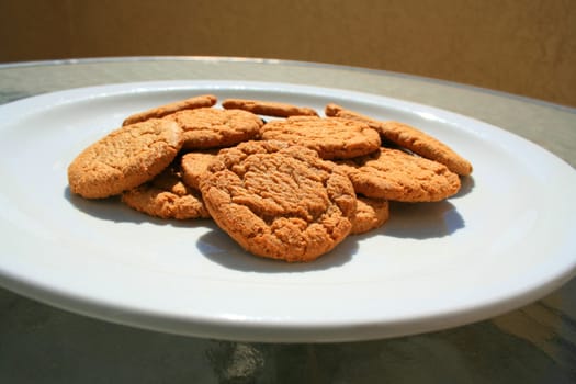 Close up of ginger snap cookies on a plate.
