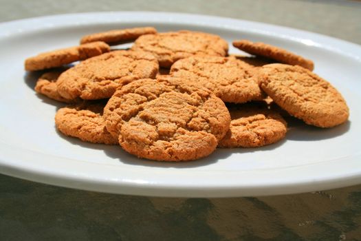 Close up of ginger snap cookies on a plate.
