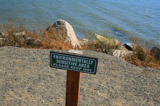 Close up of an environmentally sensitive area sign.
