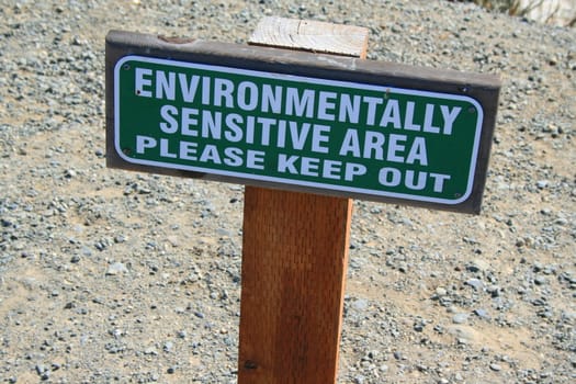 Close up of an environmentally sensitive area sign.
