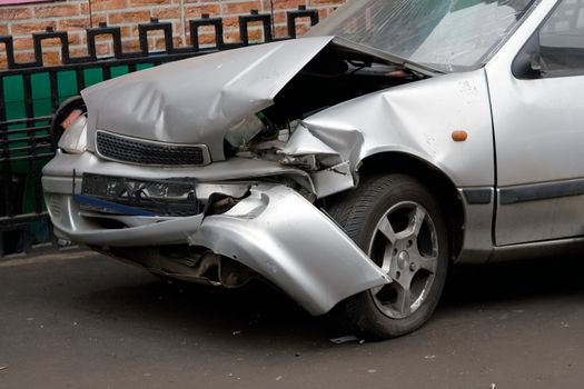 The Wrecked Car. Front of damaged auto.