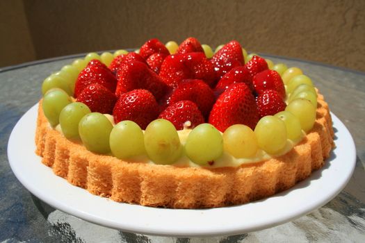 Close up of a fruit cake on a plate.
