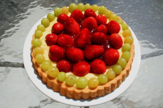 Close up of a fruit cake on a plate.
