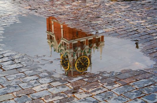 The Red Square. Reflection of the Kremlin. Chiming clock. Moscow, Russia.