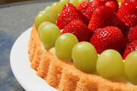 Close up of a fruit cake on a plate.
