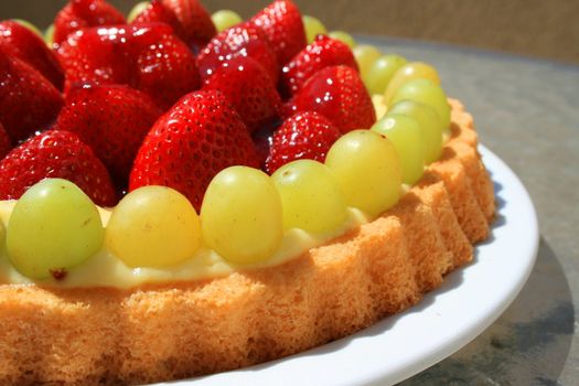 Close up of a fruit cake on a plate.
