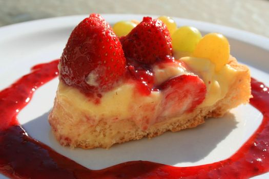 Close up of a fruit cake slice on a plate.
