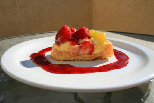 Close up of a fruit cake slice on a plate.
