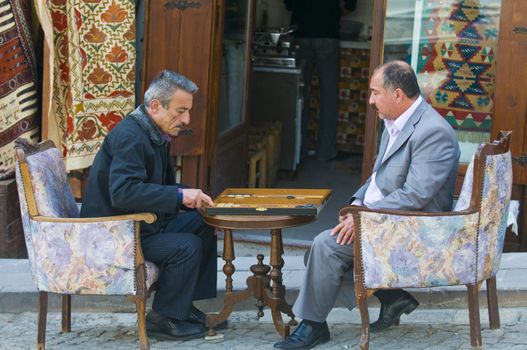 July 2008 Ankara Turkey - Two Turkish men playing backgammon in the street