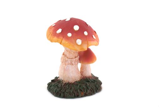 Toadstool with dots in front of a white background.            