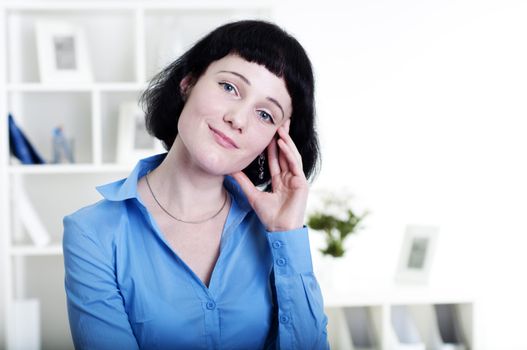 Portrait of a business woman in the office, dreams