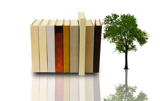 Stack of book with lonely tree on white background