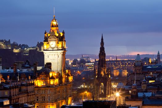 Edinburgh Clock Tower and scott monument from Calton Hill at dusk Scotland UK