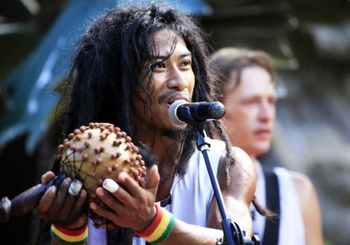 BALI, INDONESIA - JULY 43: The Asian drummer perform on stage during the performance in park of a safari July 4, 2010 in Kuta City, Bali, Indonesia