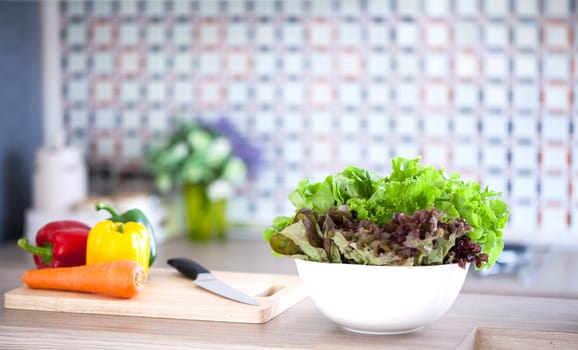 Preparing of Green Salad in domestic kitchen