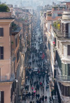 ROME, ITALY - JANUARY 27: Shoppers crowd Via Condotti on January 27, 2013. Via dei Condotti is the center of fashion shopping in Rome