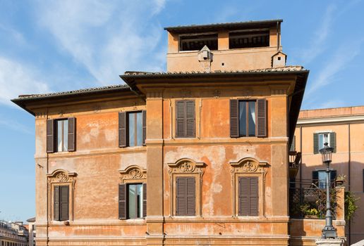 Side view of old roman house by Spanish steps in Rome housing restaurant
