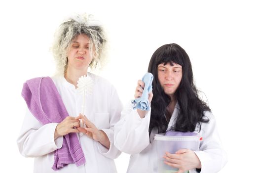 Female cleaners in white work coats