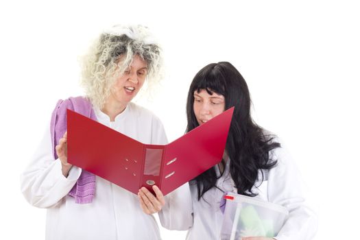 Female cleaners in white work coats