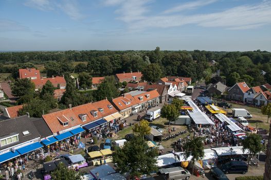 View from the top of the church to the people shopping on the markete in Renesse , Holland, the amrket is once a week in this palce