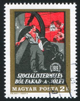 HUNGARY - CIRCA 1969: stamp printed by Hungary, shows Revolutionary poster by Steiner, Industrial Man looking at family and farm, circa 1969