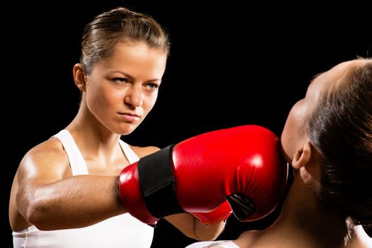 Aggressive boxing woman, hits an opponent in the head