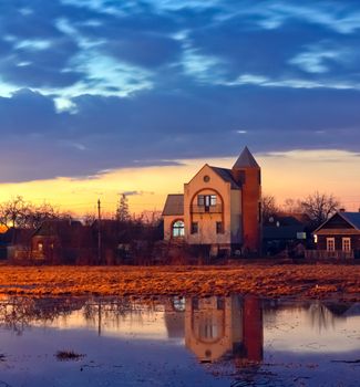 House at sunset and blue sky