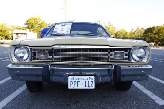 GLOUCESTER, VA, USA - OCTOBER 14: Classic 1973 Plymouth Duster in the Middle Peninsula Classic Cruisers Club weekly Car Show. Main Street Center. October 14, 2011 in Gloucester, VA, USA