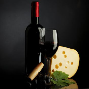 red wine and cheese on black