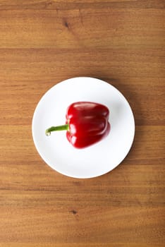 Red sweet pepper on table