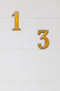 An image of the number 13 on the wall