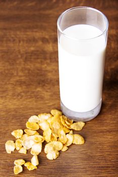 Glass of milk and corn flakes