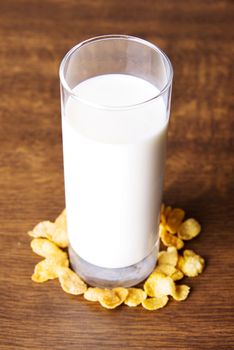 Glass of milk and corn flakes