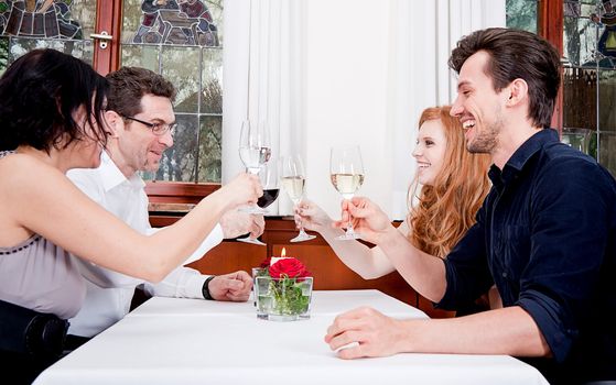 smiling happy people in restaurant drinking talking having fun 