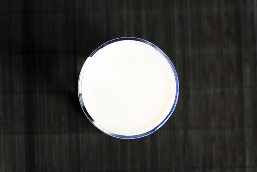 Glass of milk on table